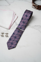 Navy floral pattern silk tie with elegant design, ideal for formal wear.